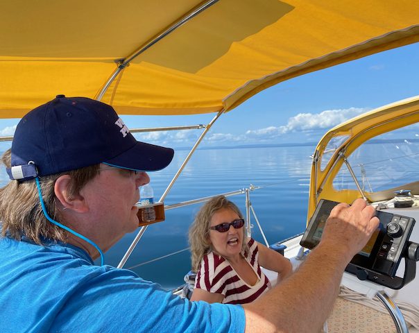 Navigating sailboat on Bras d'or Lake, Cape Breton Island, Nova Scotia