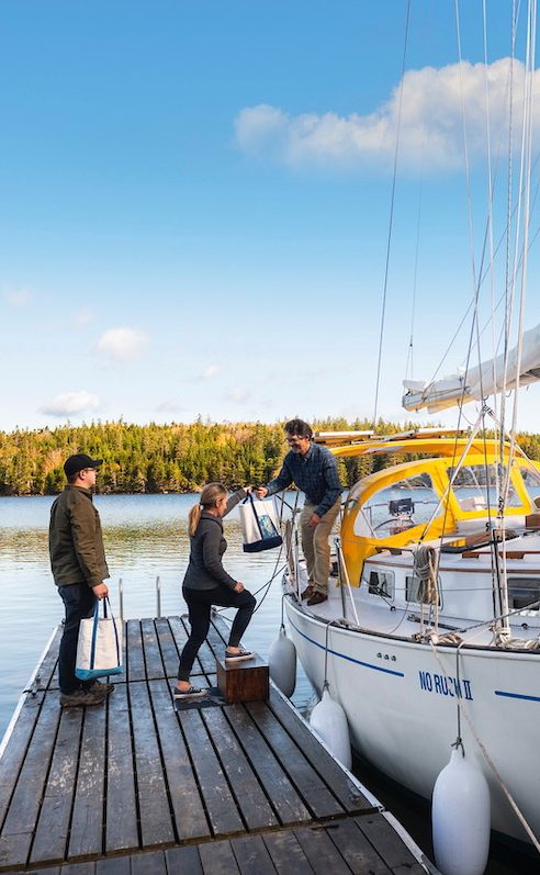 Boarding sailing yacht No Rush II at St. Peter's, Bras d'Or Lake, Cape Breton, Nova Scotia
